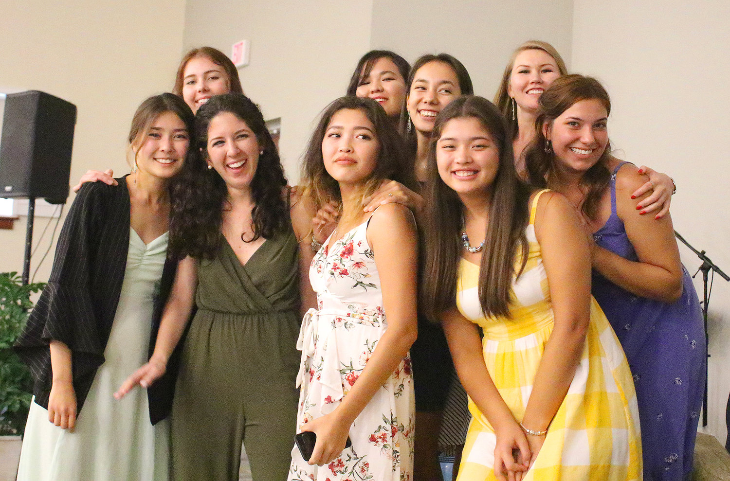 Eight young women from Kazakhstan pose with The Greatest Exchange founder, Kelly Ray, during the Night of Celebration  at Waypoint Church at Nocatee on Aug. 9.